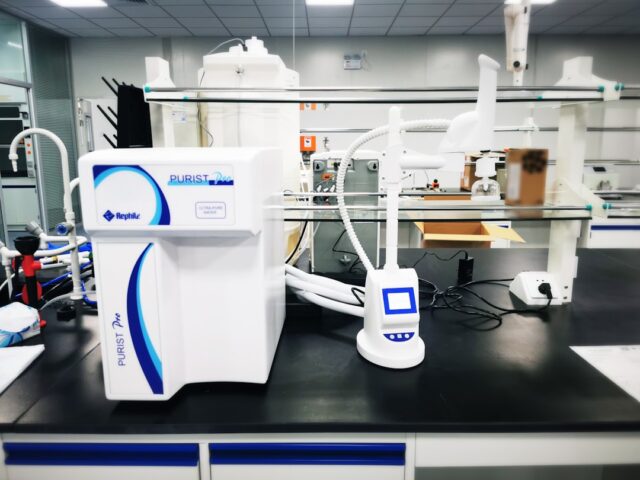 Science laboratory with modern equipment and researchers