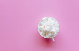How Sugar Sabotages Your Memory human brain surrounded by refined sugar cubes neuroinflammation cognitive health memory impairment