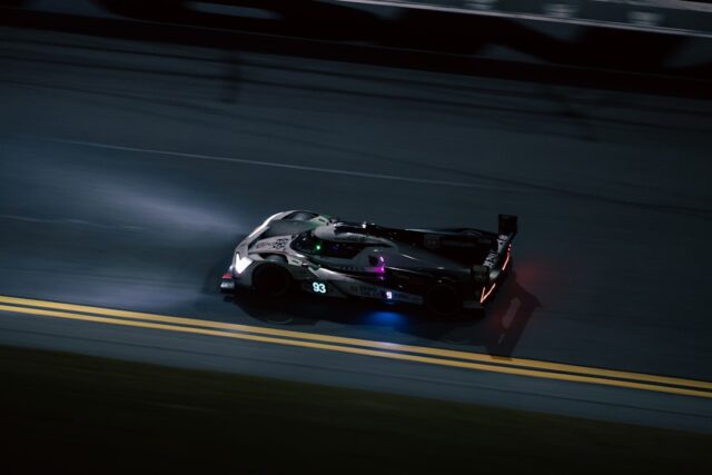 futuristic hypercar on a neon-lit track