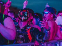 Your Next Festival Bucket List festival crowd under neon lights at a global music event
